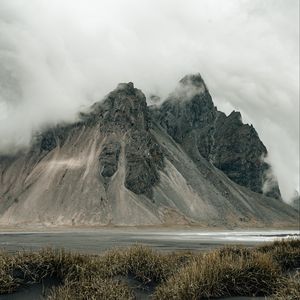 Preview wallpaper mountains, rocks, fog, cloud, grass