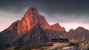 Preview wallpaper mountains, rocks, house, stones, stream