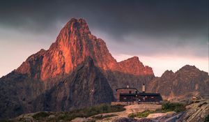 Preview wallpaper mountains, rocks, house, stones, stream