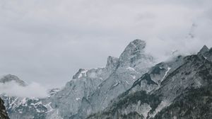 Preview wallpaper mountains, rocks, lake, fog, building