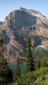 Preview wallpaper mountains, rocks, lake, spruce, sky