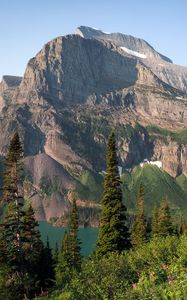 Preview wallpaper mountains, rocks, lake, spruce, sky