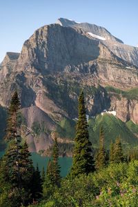 Preview wallpaper mountains, rocks, lake, spruce, sky