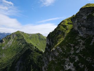 320x240 Wallpaper mountains, rocks, moss, sky, nature