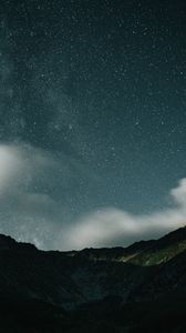 Preview wallpaper mountains, rocks, night, starry sky, stars, clouds
