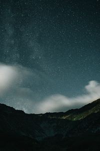 Preview wallpaper mountains, rocks, night, starry sky, stars, clouds
