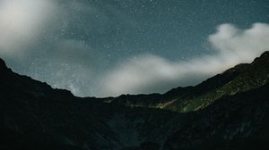 Preview wallpaper mountains, rocks, night, starry sky, stars, clouds
