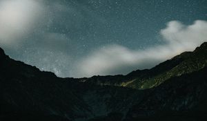 Preview wallpaper mountains, rocks, night, starry sky, stars, clouds