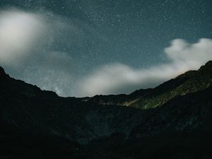 Preview wallpaper mountains, rocks, night, starry sky, stars, clouds