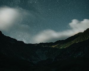 Preview wallpaper mountains, rocks, night, starry sky, stars, clouds