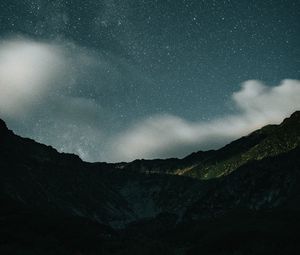 Preview wallpaper mountains, rocks, night, starry sky, stars, clouds