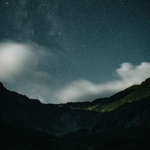 Preview wallpaper mountains, rocks, night, starry sky, stars, clouds