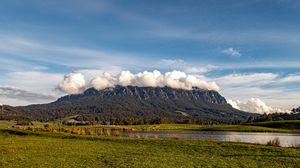 Preview wallpaper mountains, rocks, peaks, lake, grass
