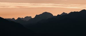 Preview wallpaper mountains, rocks, peaks, sunset, silhouette