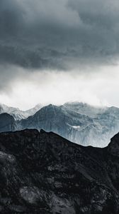 Preview wallpaper mountains, rocks, relief, snowy, clouds