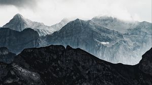 Preview wallpaper mountains, rocks, relief, snowy, clouds