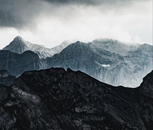 Preview wallpaper mountains, rocks, relief, snowy, clouds
