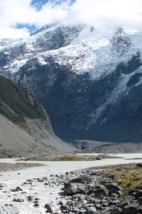 Preview wallpaper mountains, rocks, river, water, stones, snow, tops