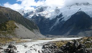 Preview wallpaper mountains, rocks, river, water, stones, snow, tops