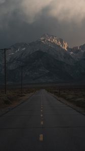 Preview wallpaper mountains, rocks, road, marking, dark