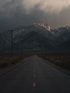 Preview wallpaper mountains, rocks, road, marking, dark