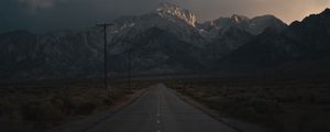 Preview wallpaper mountains, rocks, road, marking, dark