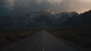 Preview wallpaper mountains, rocks, road, marking, dark