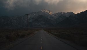 Preview wallpaper mountains, rocks, road, marking, dark