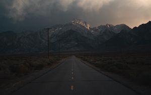 Preview wallpaper mountains, rocks, road, marking, dark