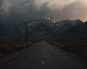 Preview wallpaper mountains, rocks, road, marking, dark