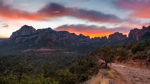 Preview wallpaper mountains, rocks, road, trees, sunset, landscape