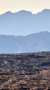 Preview wallpaper mountains, rocks, sand, grass, distance