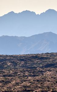 Preview wallpaper mountains, rocks, sand, grass, distance