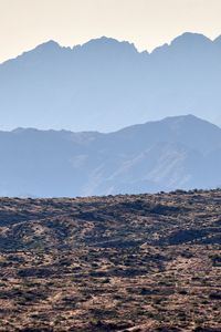 Preview wallpaper mountains, rocks, sand, grass, distance