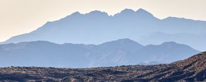 Preview wallpaper mountains, rocks, sand, grass, distance