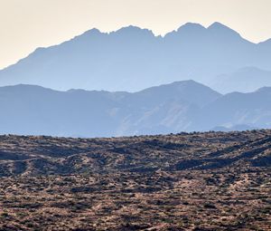 Preview wallpaper mountains, rocks, sand, grass, distance