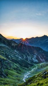 Preview wallpaper mountains, rocks, slope, rays, sky, sunrise, nature
