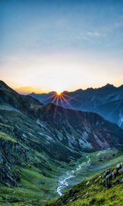 Preview wallpaper mountains, rocks, slope, rays, sky, sunrise, nature