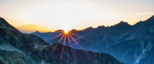 Preview wallpaper mountains, rocks, slope, rays, sky, sunrise, nature