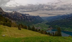 Preview wallpaper mountains, rocks, slope, grass, sky, clouds