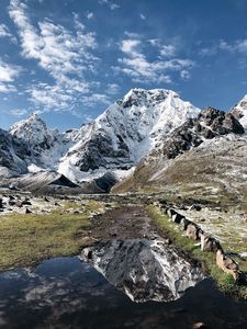 Preview wallpaper mountains, rocks, snow, snowy, lake, reflection
