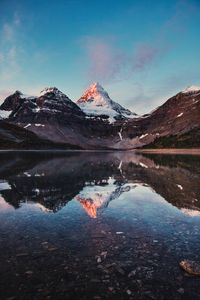 Preview wallpaper mountains, rocks, snow, snowy, lake, reflection, sky