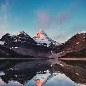 Preview wallpaper mountains, rocks, snow, snowy, lake, reflection, sky