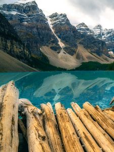 Preview wallpaper mountains, rocks, snow, snowy, logs