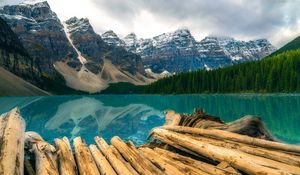 Preview wallpaper mountains, rocks, snow, snowy, logs