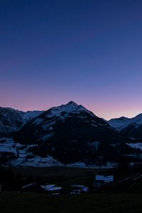 Preview wallpaper mountains, rocks, snow, snowy, sky, sunset