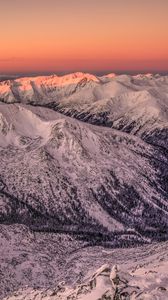 Preview wallpaper mountains, rocks, snow, snowy, sunset, sky
