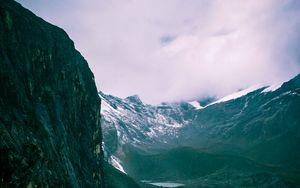 Preview wallpaper mountains, rocks, snow, snowy, grass, clouds