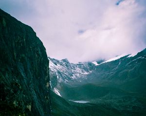 Preview wallpaper mountains, rocks, snow, snowy, grass, clouds