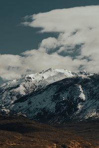 Preview wallpaper mountains, rocks, snow, snowy, peaks, sky